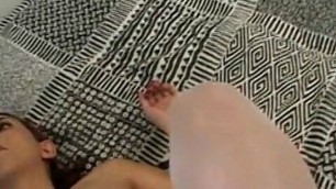 Pregnant slut sucks and fucks erected cocks on the bed