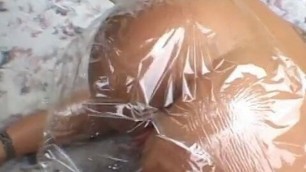 Blonde gets wrapped in foil and fucks her ass with hard cock